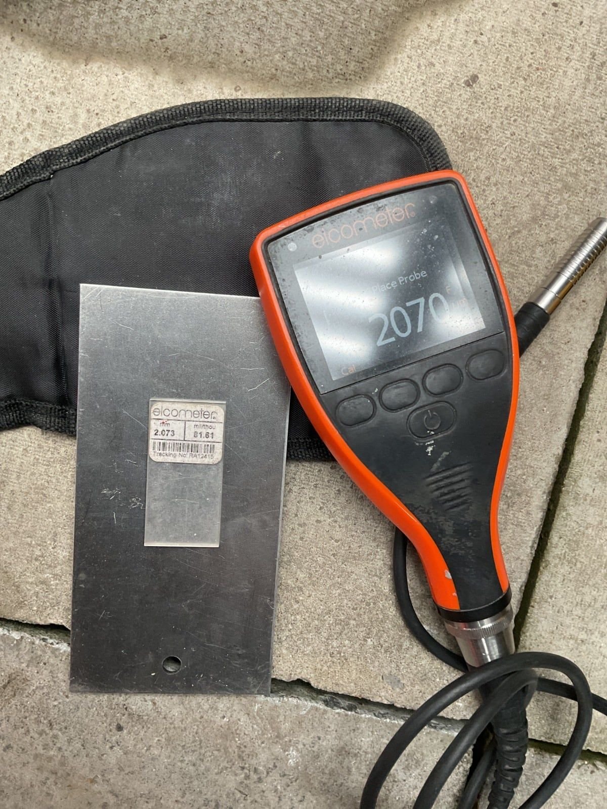 Elcometer coating thickness gauge checked against a certified calibration foil of 2.073 millimetres